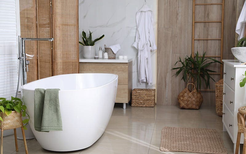 A bathroom featuring a white bathtub and a wooden shower curtain, creating a warm and inviting atmosphere.