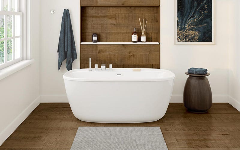 A white bathtub on a polished wooden floor, creating a serene and inviting bathroom atmosphere.